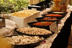 the buffet table has many different types of food on it