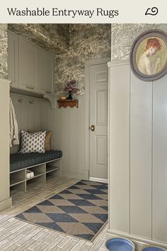 an entryway rug with blue and white checkerboard flooring in the hallway