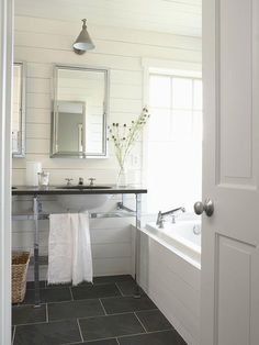 the bathroom is clean and ready to be used as a bathtub or shower stall