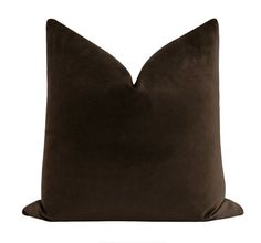 a brown pillow on a white background