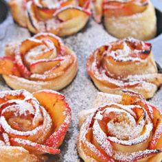 several pastries with powdered sugar on them