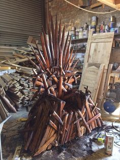 a large iron throne made out of wood sticks