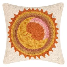 the sun and moon pillow is made from knitted yarn, with an orange circle on it