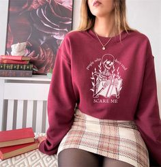 Reading is love. Reading is life. » Featuring a skeleton reading a book with roses in the background and the phrase "'People who don't read scare me." A great gift for book, reading, or Halloween lovers alike! Or to TREAT YO SELF. » The perfect, comfy, crewneck sweatshirt to keep you cozy all season. Order up a size or two for an oversized, relaxed look, and pair it with your favorite skirt, leggings, or tucked into some tapered trousers for a casual yet sophisticated fit.