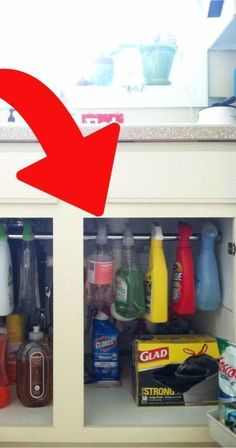 an open cabinet filled with cleaning products