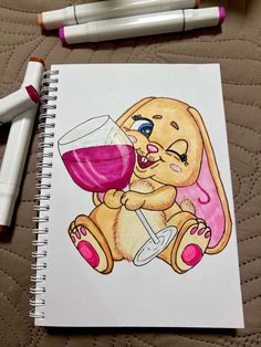 a drawing of a bunny with a glass of wine in it's hand and two markers next to it