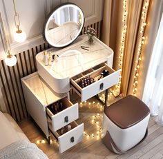 a white vanity with drawers and lights on the wall next to a bed in a bedroom