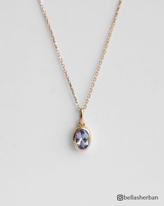 Enjoy the mesmerizing beauty of our 14K Solid Gold Oval Tanzanite Pendant Necklace, a stunning pendant that radiates elegance, refinement, and  grace.  This 14K solid gold necklace includes a breathtaking oval tanzanite--a gemstone recognized for its unique lavender color, which represents transformation and spiritual growth. The dainty design of the pendant adds a touch of modern elegance, making it a versatile and essential addition to your jewelry collection. Details * 14K Solid Gold  * 4x6mm Natural Oval-Cut Tanzanite * Removable Pendant  * Chain length: 40cm + 3cm (16" + 1.18") * Ready to ship in 14K yellow gold Processing time: The necklace is ready to ship in 14k yellow gold. If you wish to order it in 14K white gold, please note that the production process will take approximately 4 Classic Oval Tanzanite Necklaces, Classic Oval Tanzanite Necklace, Classic Tanzanite Gemstone Necklaces, Tanzanite Gemstone Necklace With Oval Pendant, Tanzanite Oval Pendant Necklace With Gemstone, Oval Tanzanite Gemstone Pendant Necklace, Gold Tanzanite Necklace For Anniversary, Elegant Oval Tanzanite Necklaces, Yellow Gold Tanzanite Pendant Necklace