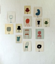 many different chairs are arranged on the wall in an artful manner, including one for each chair