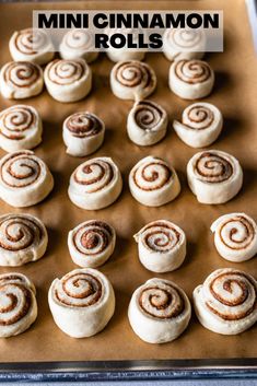 mini cinnamon rolls on a baking sheet with text overlay that says mini cinnamon rolls