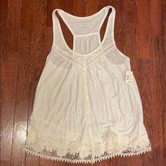 Aeropostale White Tank Top With Lace On The Bottom And Lining The Top. Size Medium. New With Tags. Casual Tank Top With Lace Trim For Vacation, Casual Lace Trim Tank Top For Vacation, Fitted Casual Tank Top For Daytime, Casual Cotton Tank Top For Daytime, Casual Beach Top With Lace Trim, Casual Tops With Lace Trim For The Beach, Cotton Tops For Beach Season, Cotton Tops For Daytime Beach Season, Hollister Tank Tops