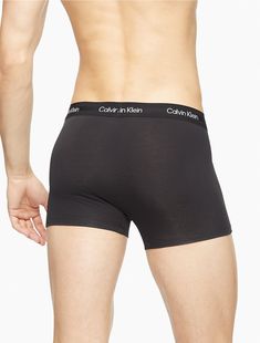 Eco-conscious with a luxurious feel, this Calvin Klein trunk is crafted from sustainably sourced modal with added breathability and long lasting fibers. Designed with a super soft recycled logo waistband, a sleek contoured pouch and a turnback hem for a clean finish.  Material: 87% Modal, 13% Elastane. Fitted Solid Color Boxer Briefs With Comfort Waistband, Fitted Solid Bottoms Multi-pack, Fitted Solid Color Bottoms Multi-pack, Fitted Boxer Briefs With Ribbed Waistband, Calvin Klein Stretch Boxer Briefs With Logo Waistband, Calvin Klein Stretch Boxer Briefs, Calvin Klein Stretch Solid Color Boxer Briefs, Stretch Boxer Briefs With Logo Waistband For Loungewear, Fitted Boxer Briefs With Logo Waistband