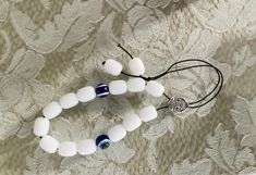 Greek worry beads, worry beads, komboloi, begleri, religious beads, prayer beads, traditional worry beads, evil eye beads, eye worry beads by HippieFishBeachArt on Etsy Traditional White Jewelry With Heart Beads, Adjustable White Spiritual Beads, White Spiritual Beads, Handmade Adjustable White Beads, Spiritual White Spacer Beads, Spiritual White Beaded Bracelets With Large Beads, Traditional White Beaded Bracelets With Spacer Beads, White Beaded Bracelet With Oval Large Beads, White Beaded Bracelets With Large Oval Beads