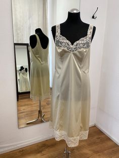 Beige vintage slip dress, Nightie, Vintage nightgown,  L size, costume department triumph underwear lingerie 1990-2000s 100% polyamide Size: 42/XL Length: 107 cm / 42inches Bust: 100 cm / 39.3 inches Waist: 90 cm / 35.4 inches Hips: 104 cm / 40.9 inches  * Please note that actual colors may vary due to your computer resolution and monitor color restrictions *Clothes  from smoke free house *Please contact me if you have any questions Thank you visiting my shop Instagram  - IvziteVintageFashion Il Sheer Sleeveless Satin Nightgown, Sleeveless Sheer Satin Nightgown, Sheer Sleeveless Slip Dress For Night, Sleeveless Bias-cut Nightgown, Sleeveless Bias Cut Nightgown, Cream Sleeveless Slip Dress For Sleep, Sleeveless Cream Slip Dress For Sleep, Vintage Lace Trim Slip Dress For Night, Vintage Sleeveless Night Dress