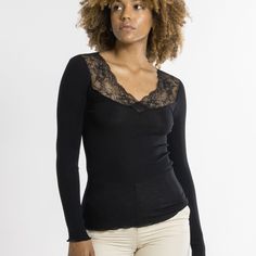 Style # 6839 Style: Ribbed Long Sleeve V-Neck Top w/ Leavers Lace Detail Fabric: 70% Merino Wool, 30% Silk. Made in Italy. Design: Long-sleeved ribbed top made of a precious and natural intimate blend of Merino Extra Fine Wool and top quality Silk, featuring a romantic and elegant Leavers Lace neckline. Rib knit fabric for an incredibly warm and soft feel and a perfect embrace on your body. Fit and Tips: Fitted. Figure-hugging. Rib Knit Fabric, Italy Design, Lace Neckline, Ribbed Top, A Romantic, Body Fit, V Neck Tops, Bra Sizes, Hosiery