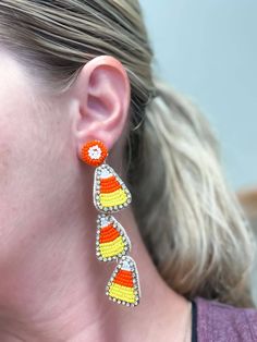 Turn heads this Halloween with these fun and festive Candy Corn Layered Beaded Dangle Earrings! With their colorful beaded layers, they'll make you look like the trick-or-treat queen! Plus, they'll look adorable no matter how you wear them! (If only getting candy was this easy!) 3"L Lead & Nickel Compliant Beaded Dangle Earrings, If Only, No Matter How, Candy Corn, Trick Or Treat, Corn, Bag Accessories, Dangle Earrings, Matter