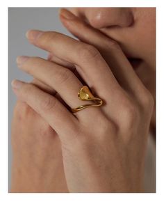 Our stunning Waves Ring is meticulously crafted from a combination of 18k gold plating and stainless steel, ensuring a perfect balance between opulence and resilience. The 18k gold plating imparts a luxurious sheen, while stainless steel provides strength and longevity. The design of the Waves Ring is inspired by the gentle ebb and flow of ocean waves, capturing the essence of fluidity and grace. The hypoallergenic nature of this ring makes it appropriate for even the most delicate skin types, e Ring Settings Types, Stylish Rings, Bagan, Geometric Ring, Gold Plated Rings, Minimalist Rings, Types Of Rings, Boho Rings, Minimalist Art