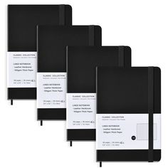 three black notebooks with white labels on them are lined up against a white background