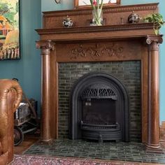 a living room with a fire place in the center and a painting on the wall