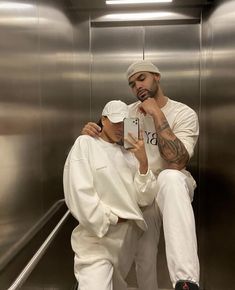 a man and woman sitting on an escalator