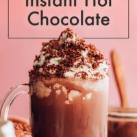 an image of a hot chocolate drink with whipped cream on top and the words 3 ingredient instant hot chocolate