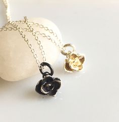 "A tiny little rose captured in sterling silver, its petals just unfolding. This necklace is perfect for everyday wear, as well as an elegant touch for any dressy occasion.   This might be a perfect bridal necklace, just a subtle finish. I am happy to do custom sets for bridesmaids, let me know how many pieces you would like and I will create a listing for you. These are cast in sterling silver, I carefully polish and finish the roses.  Options on the rose include antiqued sterling silver (pictu Rose Sterling Silver Necklace For Anniversary, Rose-colored Sterling Silver Necklace For Anniversary, Sterling Silver Rose Flower Jewelry, Delicate Rose Gold Sterling Silver Charm Necklaces, Delicate Silver Flower Shape Charm Necklace, Delicate Silver Charm Necklace With Flower, Delicate Sterling Silver Charm Necklaces For Anniversary, Dainty Sterling Silver Flower Pendant Charm Necklace, Delicate Silver Flower-shaped Charm Necklace