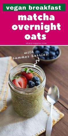 a jar filled with overnight oatmeal next to a bowl of berries and blueberries