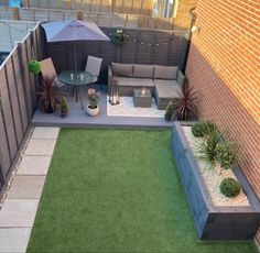 an outdoor patio with grass and seating area