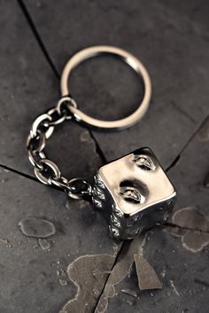 GATE OPEN A cursed cube, a "taboo object", a living barrier so powerful that there is nothing it cannot seal... and now handcrafted into one of the most unnatural keychain you'll ever see. Made from solid stainless steel, this keychain has a substantial weight and play value that is oddly satisfying. Materials: Stainless Steel, each dice weighs 30 grams (equal to one dozen pennies). GATE CLOSE Silver Metal Keychain As Gift, Silver Metal Keychains As Gifts, Silver Metal Keychain For Gift, Inverted Spear Of Heaven, Prison Realm, Cursed Items, Dice Keychain, Pushing Daisies, Wallet Chains