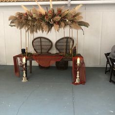 the table is set up with candles and flowers