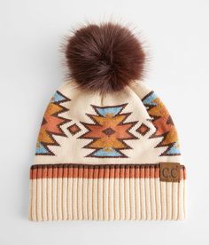 C.C® Aztec Beanie - Cream/Brown , Women's Beige Ribbed trim beanie Faux fur pom One size fits most. Beanie: 47% Rayon 31% Polyester 22% Nylon. Pom: 100% Faux Fur. Hand wash cold. Do not bleach. Do not tumble dry. Do not iron. Do not dry clean. Apparel & Accessories > Clothing Accessories > Hats Western Bag, Cowgirl Accessories, Western Shoes, Western Gifts, Cute Country Outfits, Flannel Women, Rock Revival Jeans, Cowgirl Outfits, Women's Hats