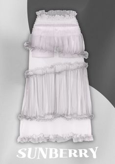 a white bed skirt with ruffles on the bottom and side, in front of a gray background