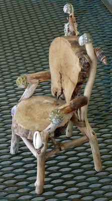 a chair made out of wood and glass beads