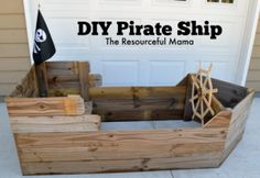 a pirate ship made out of wood sitting in front of a garage door with the words diy pirate ship on it