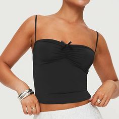 Step into summer with a splash of Y2K nostalgia in our Ruched Spaghetti Strap Camisole. This stylish piece combines vintage flair with modern fashion, making it a must-have for your warm-weather wardrobe. Whether you're catching up with friends at a café or dancing the night away at a beach party, this top will keep you looking chic and feeling comfortable. Key Features Elasticity: Medium stretch for a flattering fit that moves with you Fabric: High-quality broadcloth that's both durable and bre Y2k Nostalgia, Backless Crop Top, Summer Crop Tops, Contemporary Fashion, Modern Fashion, Style Classic, Beach Party, High Waist Jeans, Warm Weather