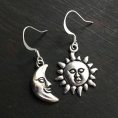 Tibetan silver sun and moon charms, on silver plated brass fishhooks. ..: V I E W   S H O P:.. www.lotusfairy.etsy.com www.shopEarthshine.com ..: P O L I C I E S :.. Please see the drop down FAQs menu All items are FINAL SALE. ★ I M P O R T A N T ★ This product is not intended to be used by, or around,  anyone under the age of 13.  ShopEarthshine.com ★ lotusfairy.etsy.com  Canadian buyers:  Prices shown include GST/HST. Silver Sun And Moon Drop Earrings, Silver Sun And Moon Design Drop Earrings, Sterling Silver Sun And Moon Dangle Earrings, Silver Symbolic Earrings With Sun And Moon Design, Silver Earrings With Sun And Moon Design - Symbolic, Sterling Silver Dangle Earrings With Sun And Moon Design, Symbolic Silver Earrings With Sun And Moon Design, Adjustable Sun And Moon Sterling Silver Earrings, Adjustable Sterling Silver Earrings With Sun And Moon Design