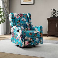 a living room with a blue flowered recliner and white rug on the floor