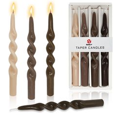 three candles are in the box and one is made out of chocolate, while the other two are shaped like spirals