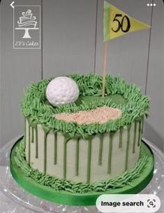 a cake decorated with icing and a golf ball