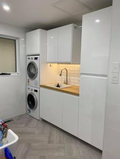 a washer and dryer in a small room