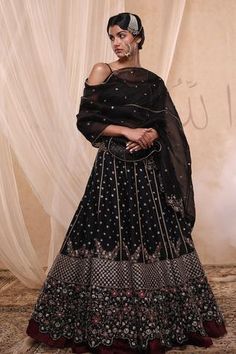 Black lehenga with floral embroidered motifs. Comes with blouse and sheer dupatta.
Components: 3
Fabric: Raw Silk, Silk Organza
Neckline: Sweetheart
Sleeve Length: Sleeveless
Color: Black
Embroidered
Embroidered dupatta
Floral motif work
Crochet trims - Aza Fashions Bustier Blouse, Black Embroidered Blouse, Black Lehenga, Wedding Lehengas, Designer Lehengas, Corset Blouse, Embroidered Lehenga, Lehenga Blouse, Designer Lehenga