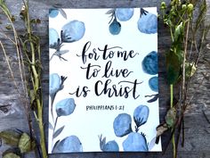 a card with blue flowers and the words for me to live is christ