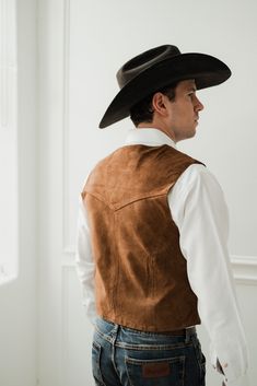 Enhance your western look with the Scully Pigsuede Vest! Made from high-quality pig suede, this vest is perfect for completing your cowboy or cowgirl outfit. The soft texture adds a touch of luxury while the classic design adds a timeless appeal. Upgrade your wardrobe today! 100% suede leather Snap front closures Front welt pockets Front yoke Acetate satin lining and back FIT NOTE: Vest sizing runs small Sleeveless Classic Cowboy Outfit, Combat Boots Heels, Wedding Vest, Western Vest, Knit Swimwear, Straw Cowboy Hat, Felt Cowboy Hats, Cap Fashion, Concert Fashion