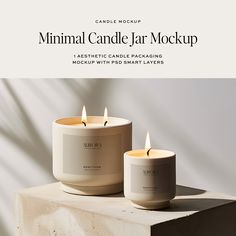 two candles sitting next to each other on top of a block of concrete with the text minimal candle jar mockup