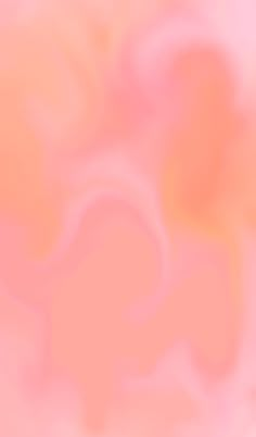 a blurry image of an orange and pink background