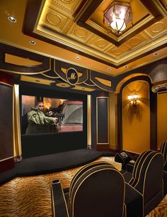 a home theater with chairs and a projector screen