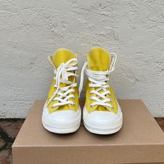 New Without Tags Converse High Top Sneakers In A Bright Yellow. Rare Model With White Lettering On Heel. Spring Flat High-top Sneakers For Streetwear, Yellow High-top Sneakers For Spring, Yellow Canvas Lace-up High-top Sneakers, Yellow Lace-up Canvas High-top Sneakers, Yellow Canvas Sneakers With Round Toe, Yellow Canvas High-top Sneakers With Vulcanized Sole, Retro Yellow Sneakers For Summer, Yellow High-top Canvas Sneakers, Summer Slip-on High-top Sneakers For Streetwear