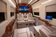 the inside of a private jet with leather seats