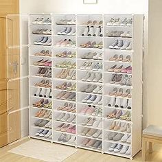 the shoe rack is filled with many pairs of shoes