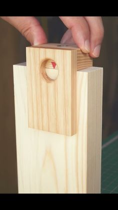 a person is trying to make a wooden object out of wood